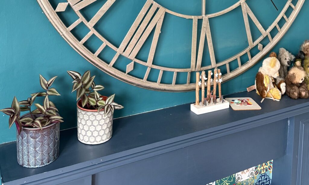 Two Tradescantia plants on a mantelpiece in a Georgian living room